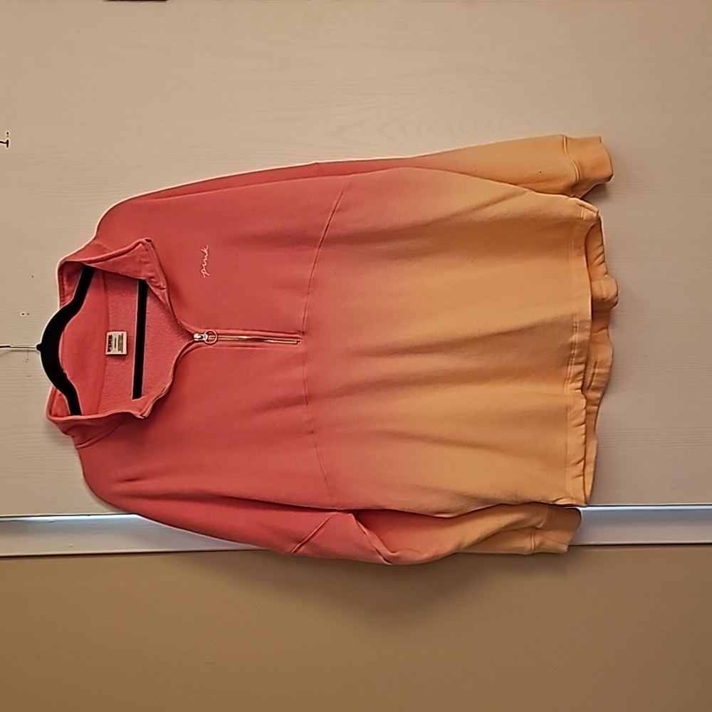 Pink sweatshirt in pink and like a light peach. The pic shows the colors better